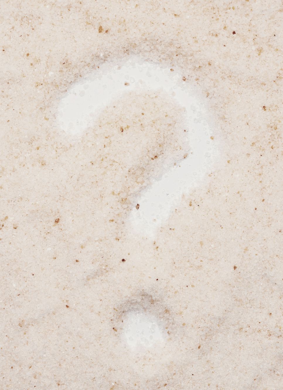 Question Mark in the sand on the beach